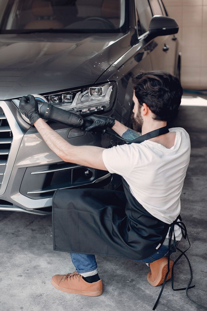 Man polish car garage