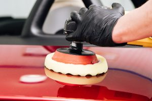 Close up person cleaning car exterior
