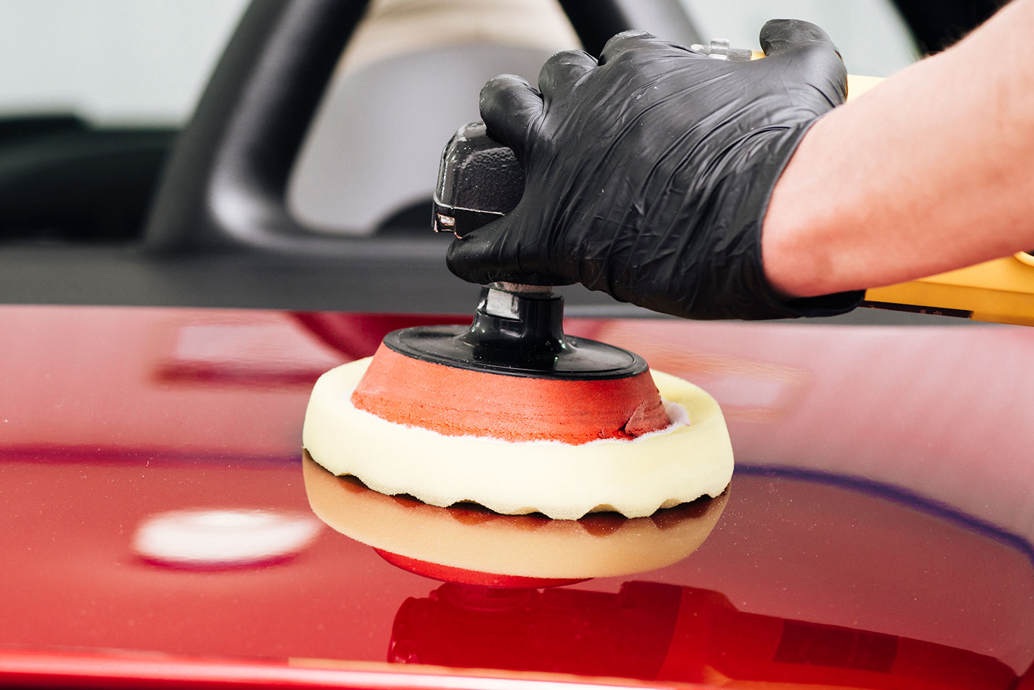 Close up person cleaning car exterior