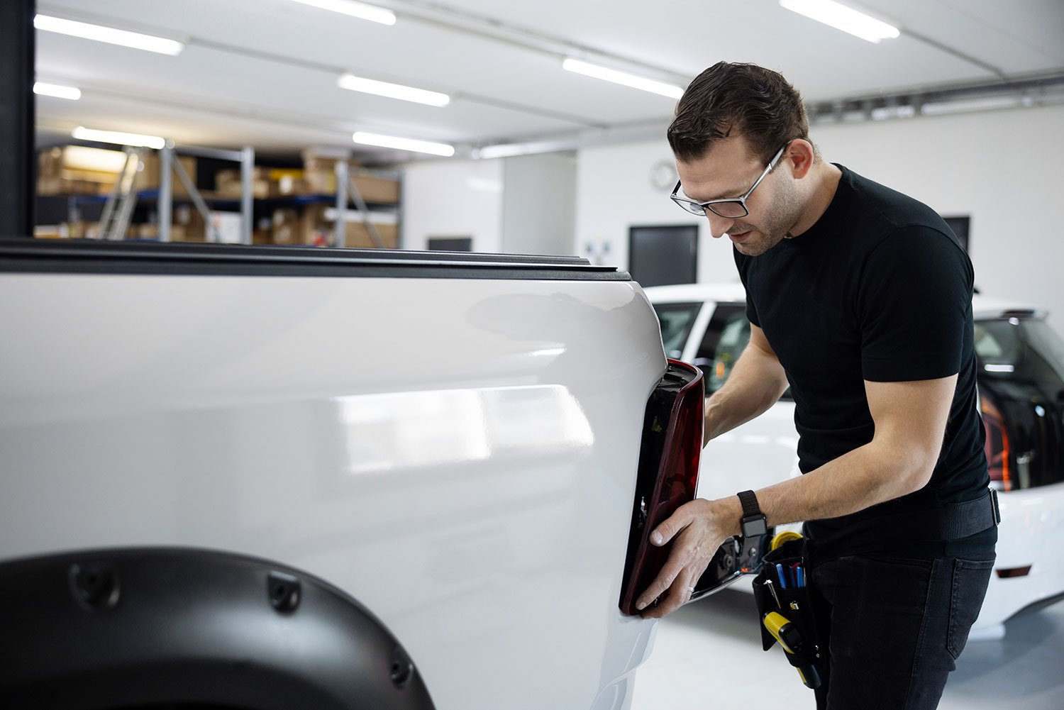 Medium shot man fixing car